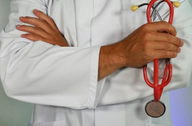 Photo by Online Marketing doctor holding red stethoscope